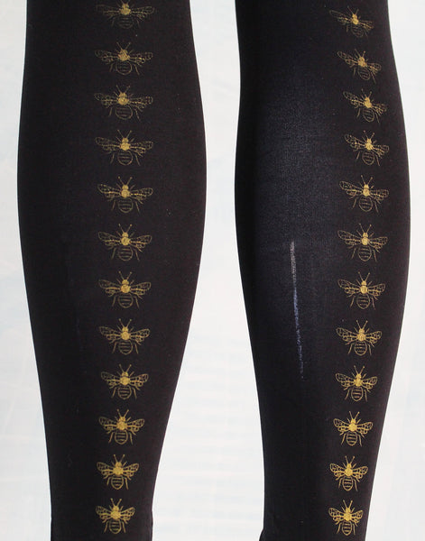 80 denier black footless tights, yellow hand screen printed bee stripe, close up detail